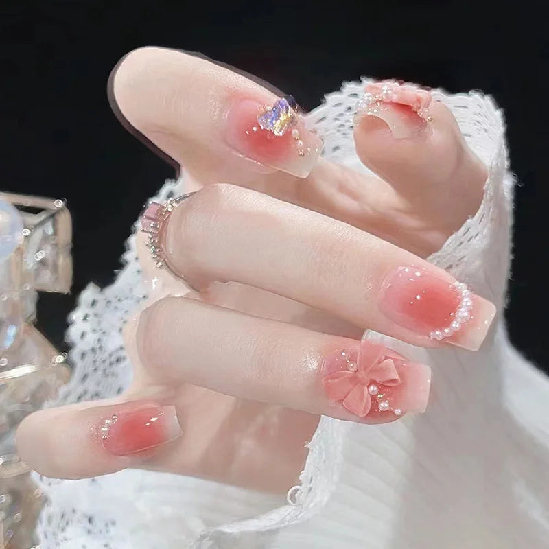 Blush rose faux ongles nœud papillon diamant perle conception 3D presse sur les pointes d'ongles avec bord lisse inoffensif ongles femme faux ongles à faire soi-même